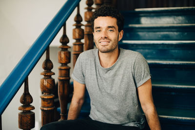 Portrait of young man sitting outdoors