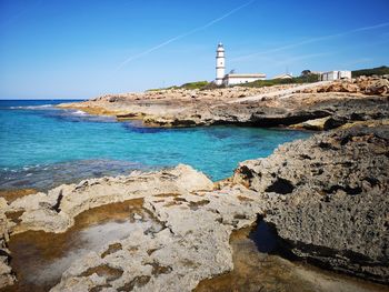 Scenic view of sea and buildings against sky