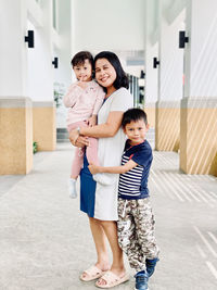 Full length portrait of happy friends