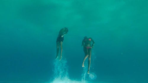 People swimming in water