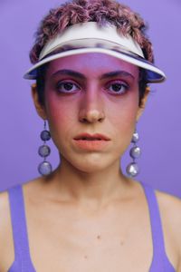 Portrait of young woman wearing hat