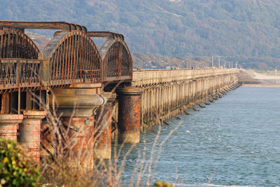 Bridge over river against sky