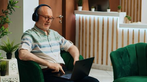 Young man using laptop at home