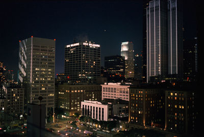 Illuminated buildings in city at night