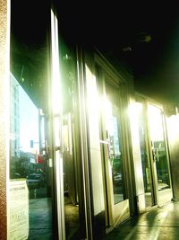 Illuminated building seen through glass window