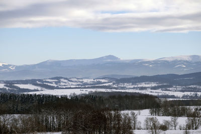 Scenic view of snowcapped mountains against sky