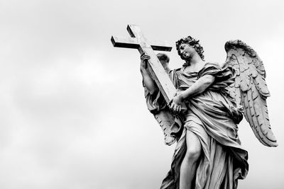 Low angle view of statue against sky