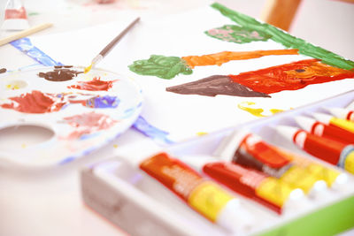 Close-up of multi colored paint on table