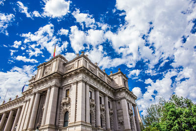 Low angle view of historical building against cloudy sky