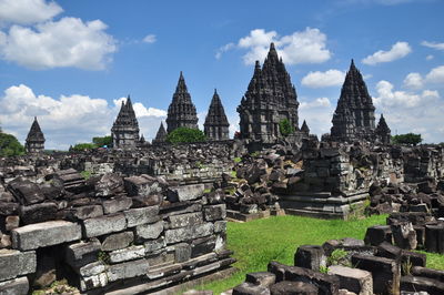 Panoramic view of temple against buildings