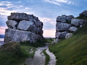 Scenic view of rock formations against sky