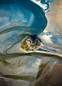 Aerial view of city amidst sea