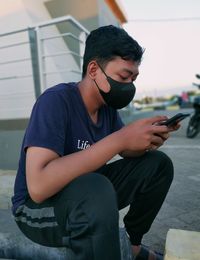 Young man using mobile phone