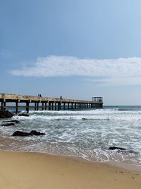 Pier over sea against sky