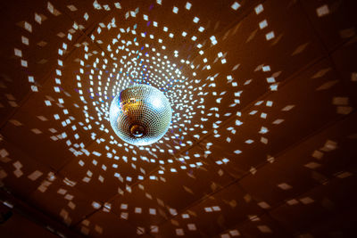 Low angle view of illuminated ceiling