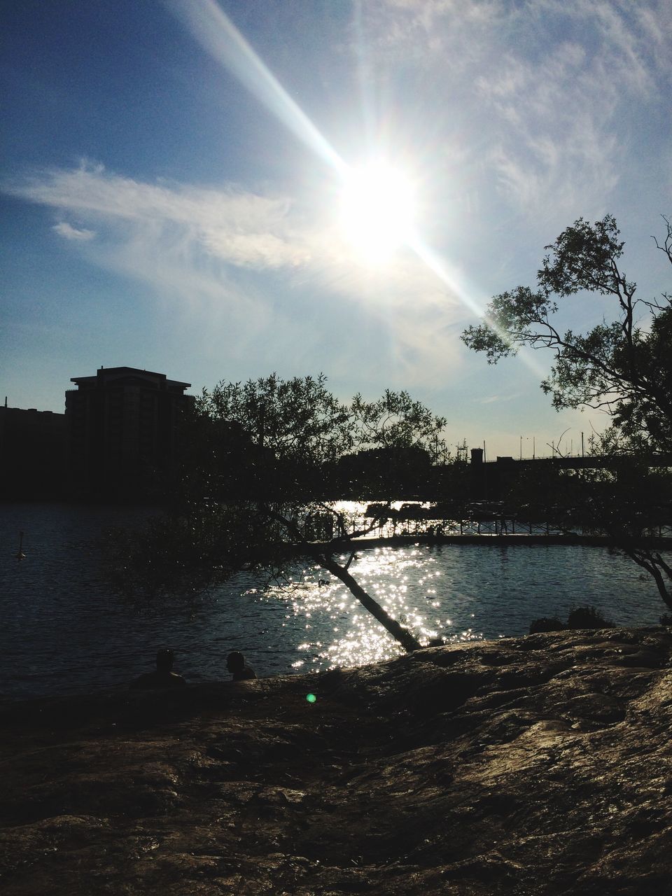 sun, water, sunlight, sunbeam, reflection, sky, lens flare, tree, lake, tranquility, sunny, river, tranquil scene, nature, built structure, scenics, beauty in nature, bright, architecture, outdoors