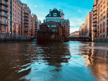 Canal passing through city buildings