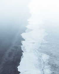 High angle view of foggy beach