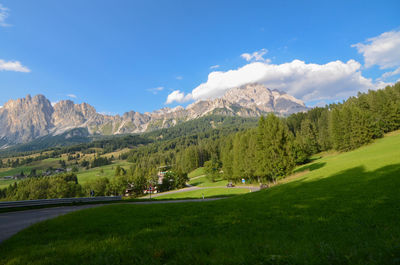 Scenic view of landscape and mountains against sky