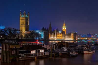 Illuminated buildings in city at night