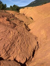 Scenic view of desert land against sky