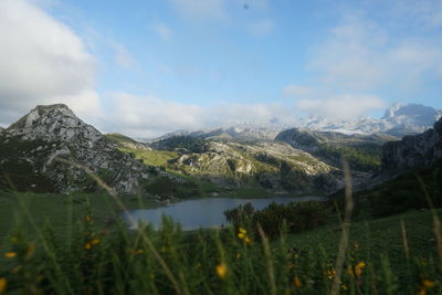 Scenic view of lake and mountains against sky