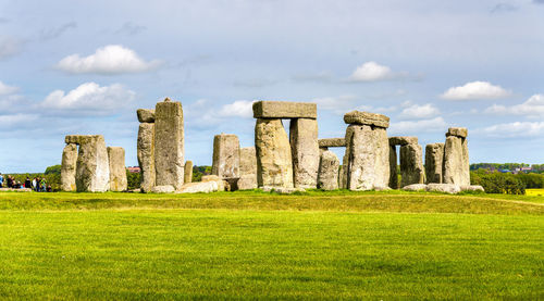 Built structure on field against sky