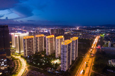 High angle view of illuminated buildings in city at night