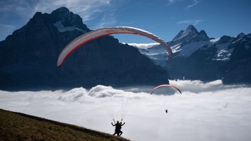 High angle view of people paragliding