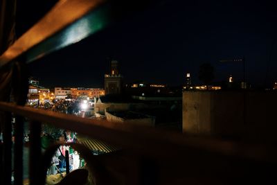 High angle view of illuminated buildings against sky at night