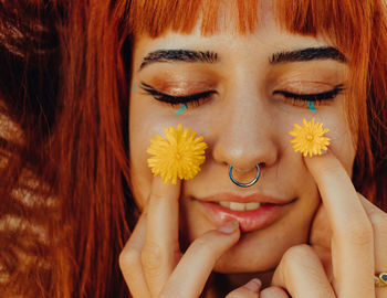 Close-up portrait of a smiling young woman