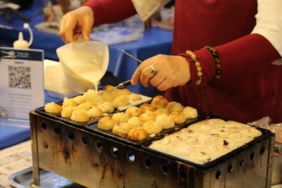 Midsection of man preparing food