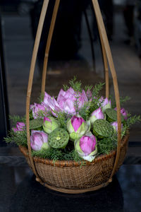 Close-up of purple flowering plant in basket