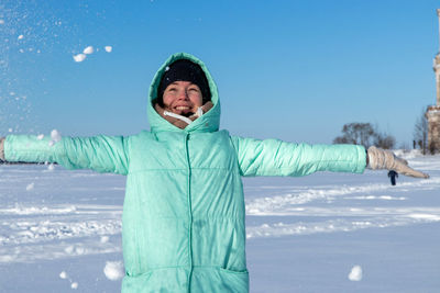 Full length of man standing in snow