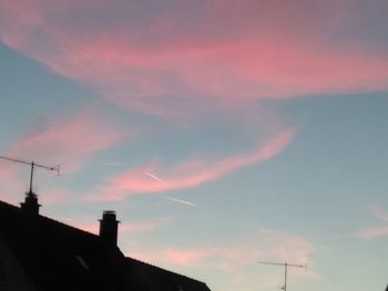 Low angle view of silhouette building against sky during sunset