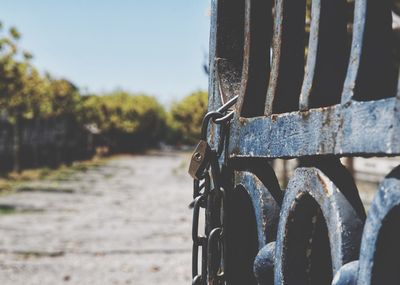 Close-up of rusty bicycle on field