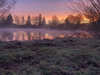 Scenic view of lake against sky during sunset