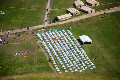 High angle view of cars on field