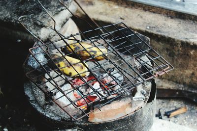 High angle view of bananas on old grill