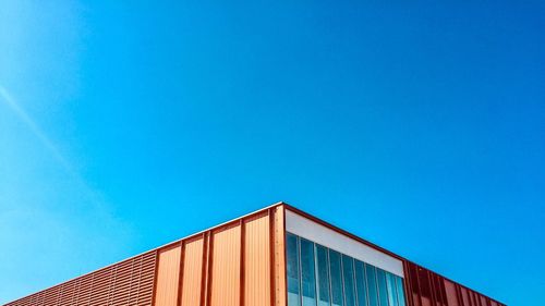 Low angle view of building against blue sky