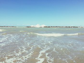 Scenic view of beach against clear sky