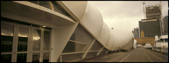 Exterior of modern buildings in city against sky