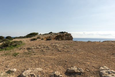 Scenic view of sea and rocks against sky