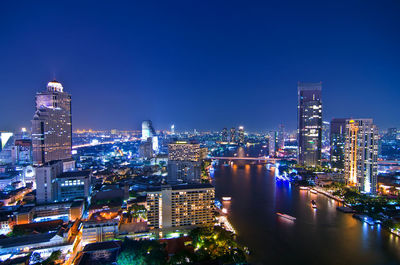 Illuminated buildings in city at night