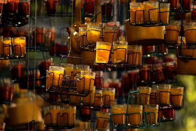 Low angle view of tea cups decoration hanging outdoors