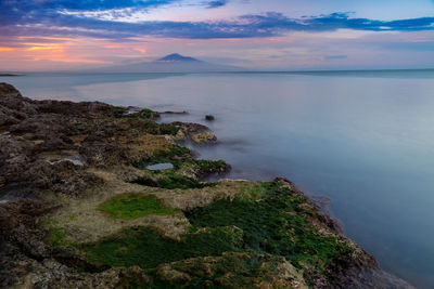 Scenic view of sea against sky during sunset