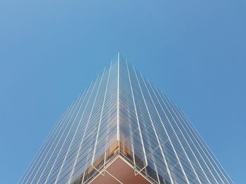 Low angle view of suspension bridge against sky