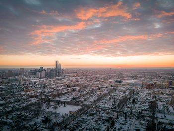 High angle view of city at sunset