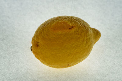 Close-up of fruit against white background