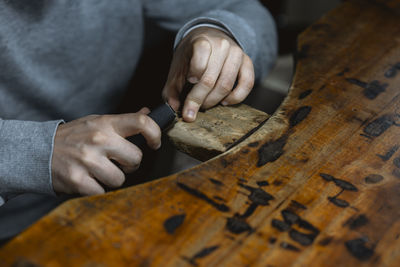 Midsection of man working in workshop